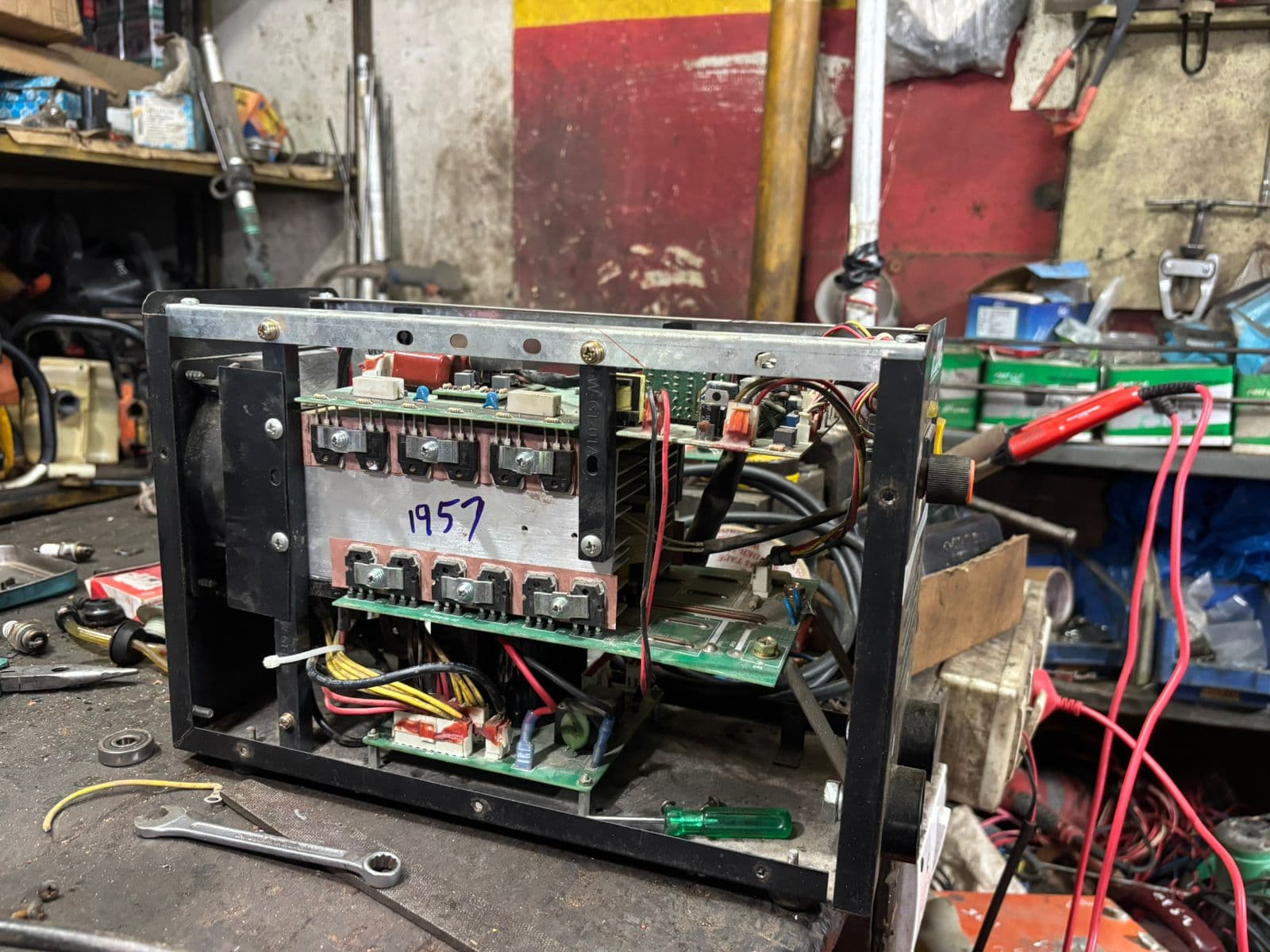Open inverter welding machine showing power boards during diagnosis